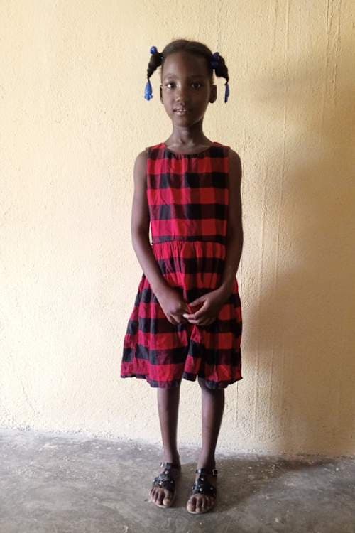 An unsponsored girl named Djouna from Haiti who is vulnerable to exploitation and has waited 461 days for a sponsor.