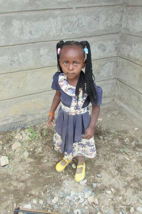 An unsponsored girl named Mbithe from Kenya who lives in an AIDS-affected area and has waited 393 days for a sponsor.