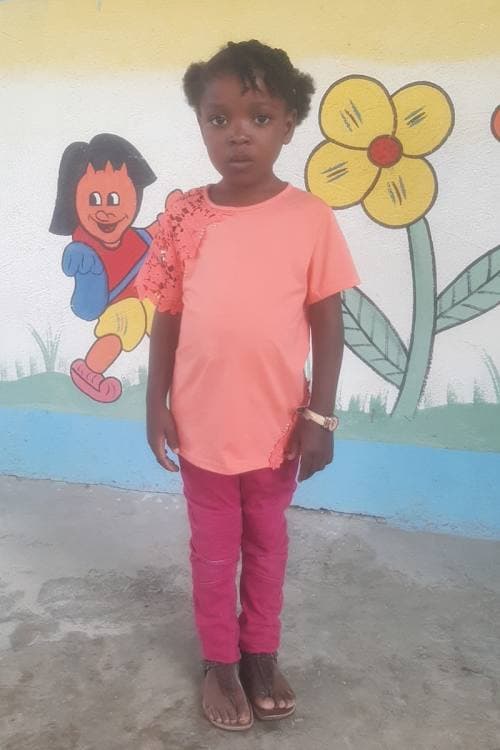 An unsponsored girl named Kenlove from Haiti who is vulnerable to exploitation and has waited 396 days for a sponsor.