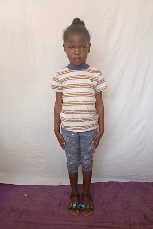 An unsponsored girl named Djina from Haiti who is vulnerable to exploitation and has waited 480 days for a sponsor.