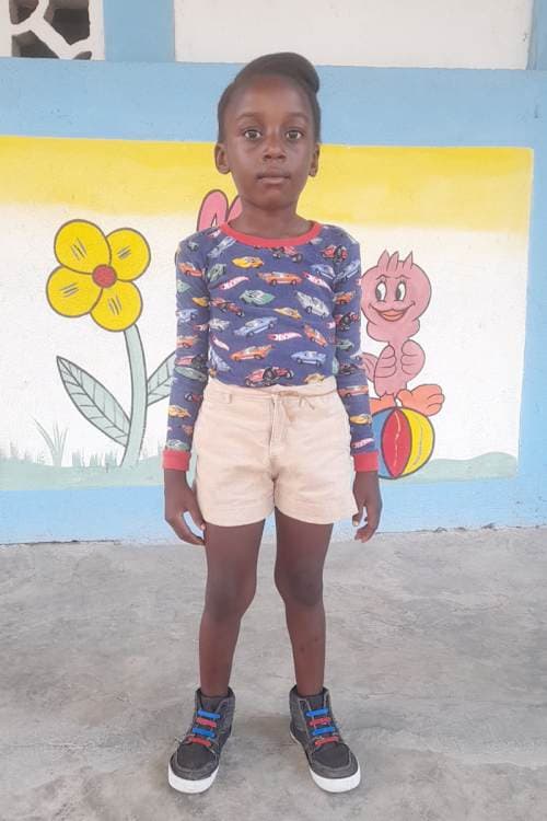 An unsponsored girl named Esther from Haiti who is vulnerable to exploitation and has waited 392 days for a sponsor.