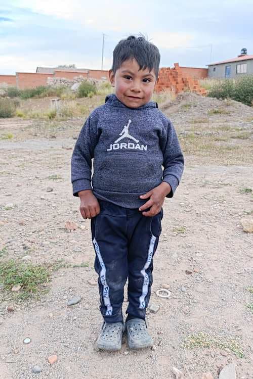 An unsponsored boy named Ian from Bolivia who has waited 459 days for a sponsor.