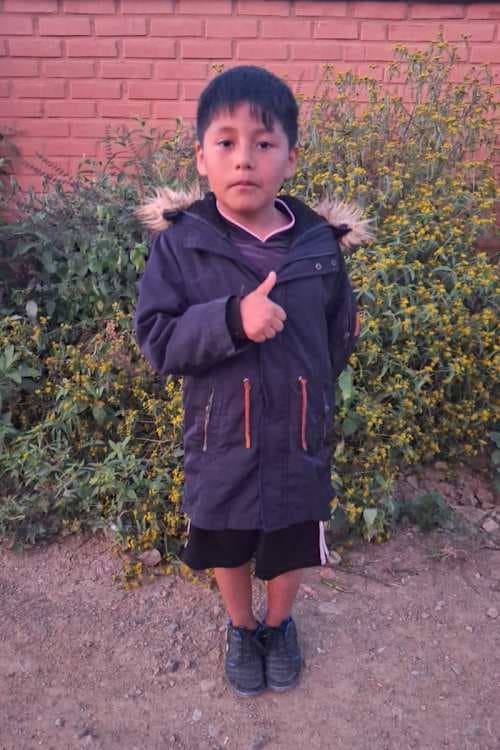 An unsponsored boy named Milder from Bolivia who has waited 470 days for a sponsor.