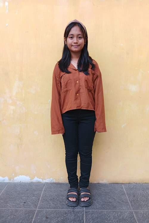 An unsponsored girl named Nancy from Indonesia who has waited 357 days for a sponsor.