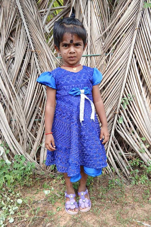 An unsponsored girl named Kapiksi from Sri Lanka who has waited 584 days for a sponsor.