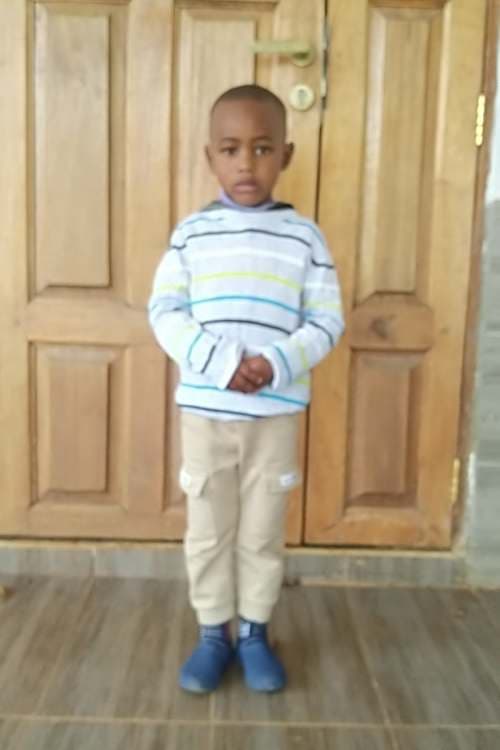 An unsponsored boy named Mwaura from Kenya who lives in an AIDS-affected area and has waited 470 days for a sponsor.