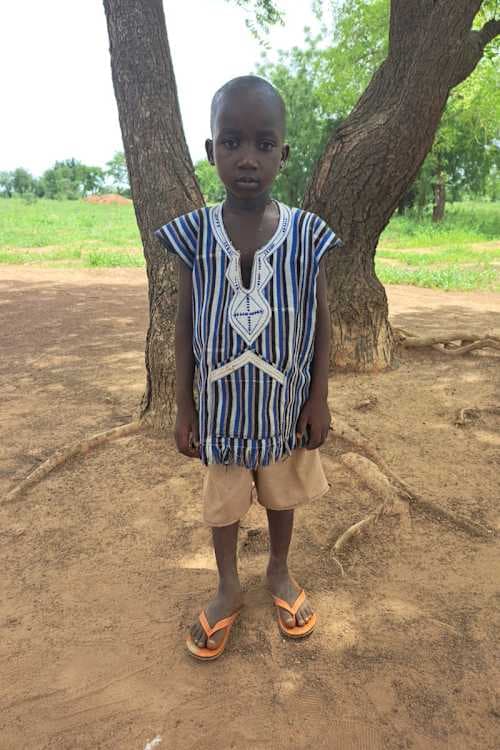 An unsponsored boy named Richmond from Ghana who lives in an AIDS-affected area and has waited 322 days for a sponsor.