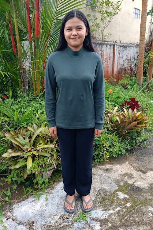 An unsponsored girl named Sela from Indonesia who has waited 318 days for a sponsor.