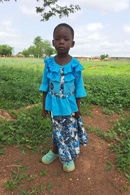 An unsponsored girl named N-muakan from Ghana who lives in an AIDS-affected area and has waited 413 days for a sponsor.