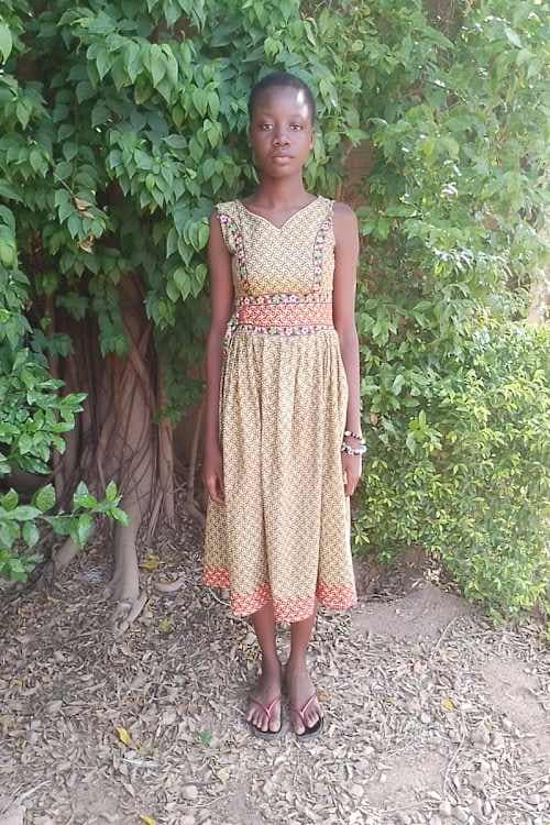 An unsponsored girl named Evelyne from Burkina Faso who lives in an AIDS-affected area, is vulnerable to exploitation and has waited 455 days for a sponsor.