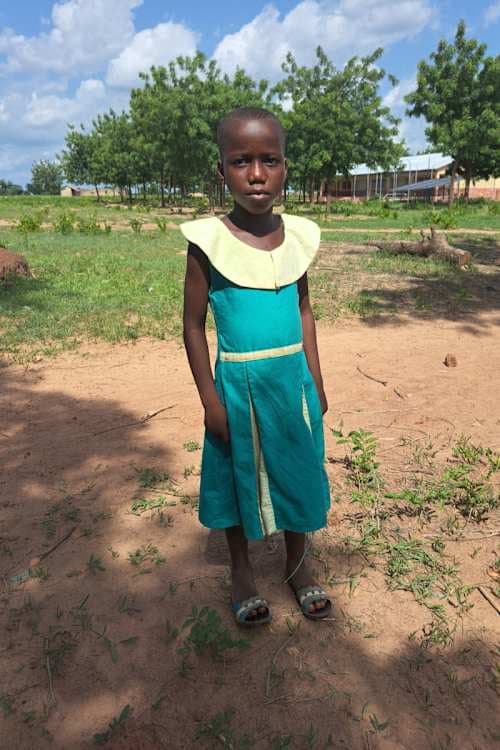 An unsponsored girl named Kimonyan from Ghana who lives in an AIDS-affected area and has waited 342 days for a sponsor.
