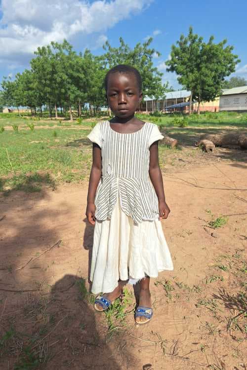 An unsponsored girl named N-Nagrini from Ghana who lives in an AIDS-affected area and has waited 342 days for a sponsor.