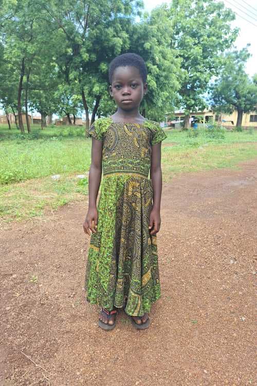 An unsponsored girl named Nkalikbi from Ghana who lives in an AIDS-affected area and has waited 415 days for a sponsor.