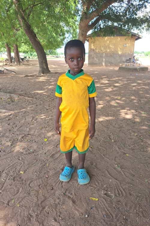 An unsponsored boy named Idoonbi from Ghana who lives in an AIDS-affected area and has waited 334 days for a sponsor.