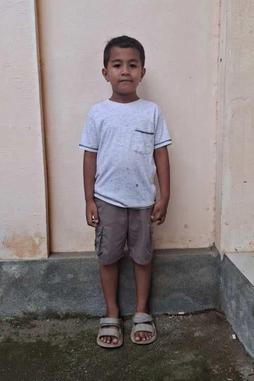 An unsponsored boy named Ghevio from Indonesia who has waited 565 days for a sponsor.