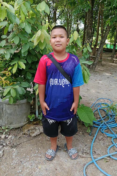 An unsponsored boy named First from Thailand who has waited 550 days for a sponsor.