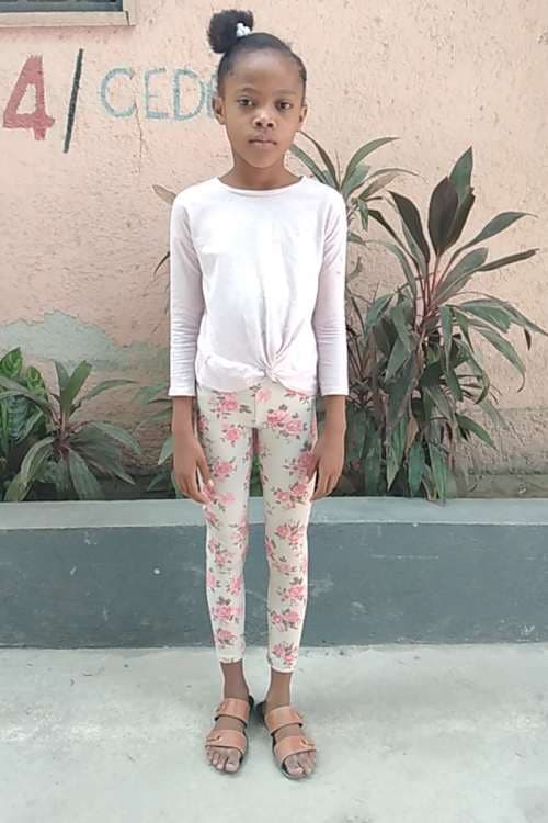 An unsponsored girl named Vidjina from Haiti who is vulnerable to exploitation and has waited 481 days for a sponsor.