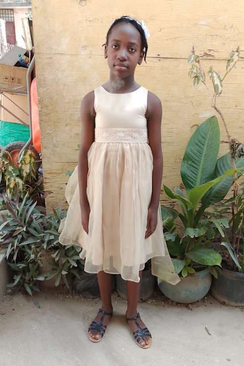 An unsponsored girl named Nehemie from Haiti who is vulnerable to exploitation and has waited 444 days for a sponsor.