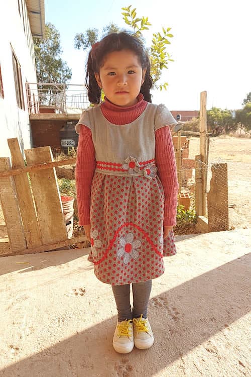 An unsponsored girl named Sarai from Bolivia who has waited 396 days for a sponsor.