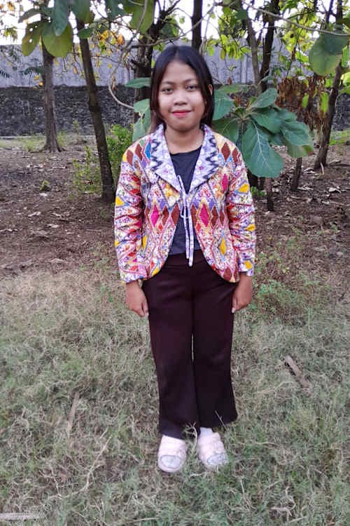 An unsponsored girl named Yollan from Indonesia who has waited 348 days for a sponsor.