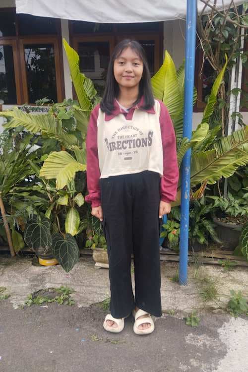 An unsponsored girl named Jepi from Indonesia who has waited 351 days for a sponsor.