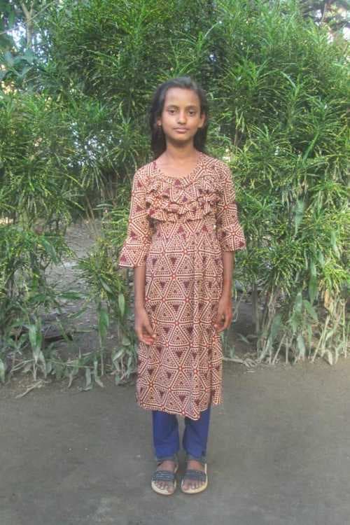 An unsponsored girl named Asamoni from Bangladesh who is vulnerable to exploitation and has waited 400 days for a sponsor.