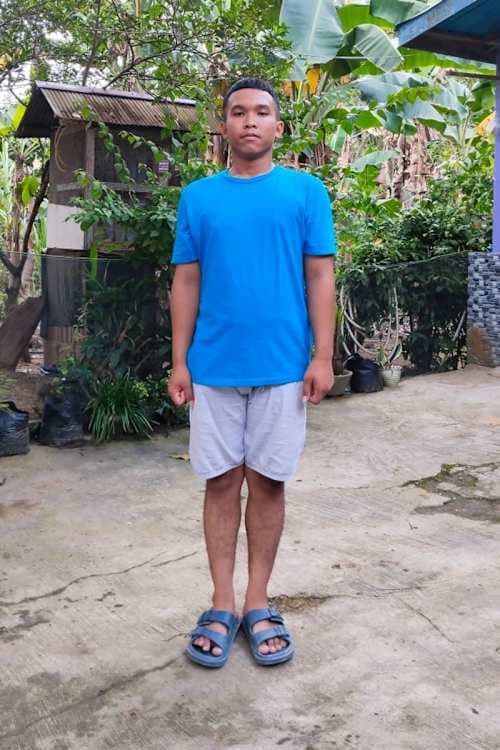 An unsponsored boy named Chris from Indonesia who has waited 429 days for a sponsor.