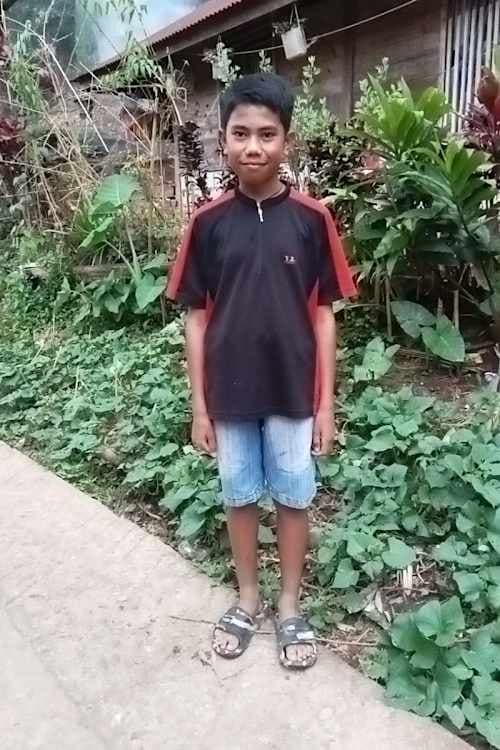 An unsponsored boy named Randi from Indonesia who has waited 534 days for a sponsor.