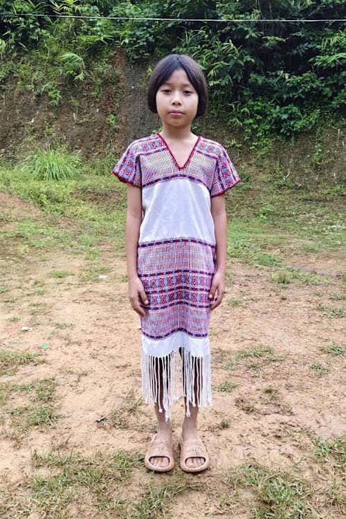 An unsponsored girl named Paw Lay moo from Thailand who has waited 443 days for a sponsor.