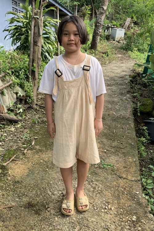 An unsponsored girl named Kue Kue from Thailand who has waited 331 days for a sponsor.