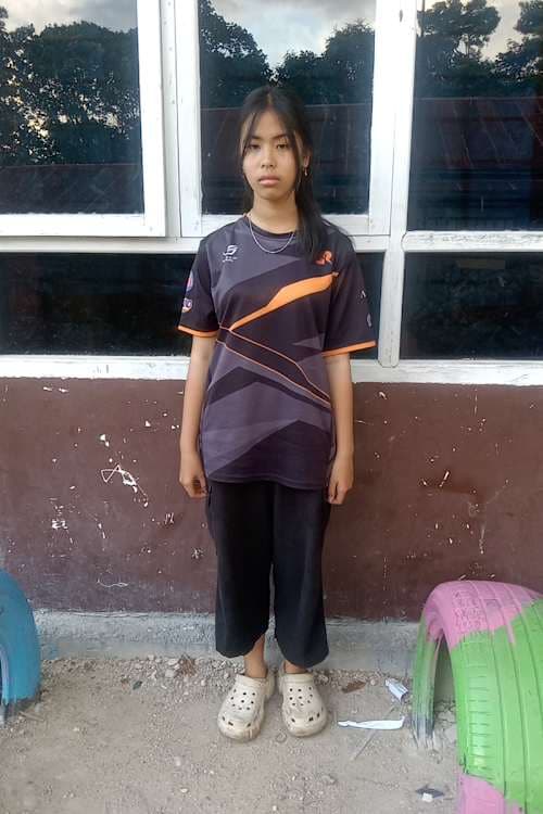 An unsponsored girl named Aling from Indonesia who has waited 183 days for a sponsor.