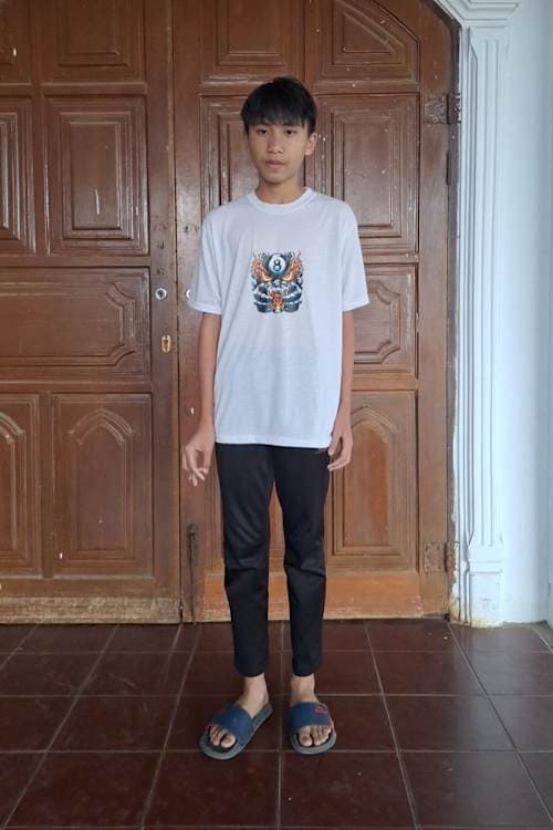 An unsponsored boy named Key from Indonesia who has waited 394 days for a sponsor.