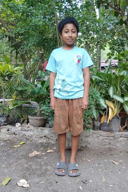 An unsponsored boy named Mansa from Indonesia who has waited 518 days for a sponsor.