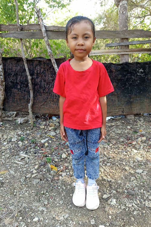 An unsponsored girl named Erni from Indonesia who has waited 472 days for a sponsor.