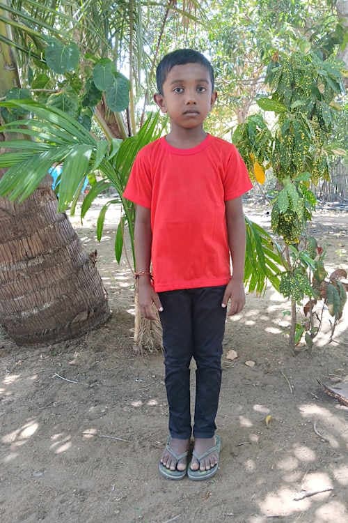 An unsponsored boy named Pavi from Sri Lanka who has waited 558 days for a sponsor.