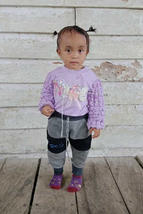 An unsponsored girl named Sela from Indonesia who has waited 545 days for a sponsor.