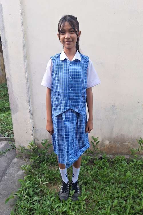 An unsponsored girl named Regina from Indonesia who has waited 155 days for a sponsor.