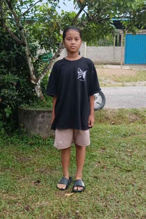 An unsponsored girl named Erly from Indonesia who has waited 225 days for a sponsor.