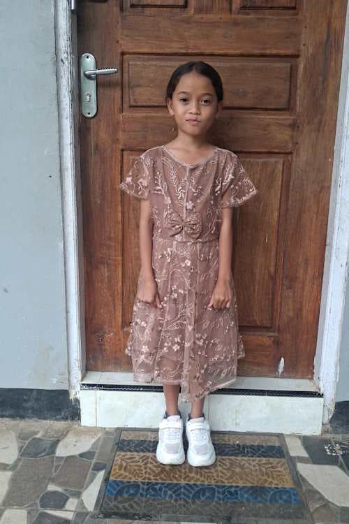 An unsponsored girl named Tika from Indonesia who has waited 437 days for a sponsor.