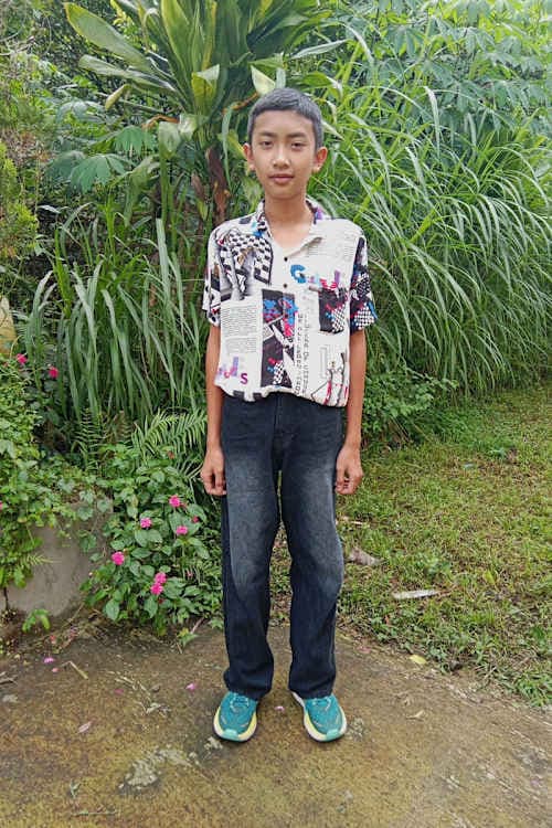 An unsponsored boy named Krishna from Indonesia who has waited 524 days for a sponsor.
