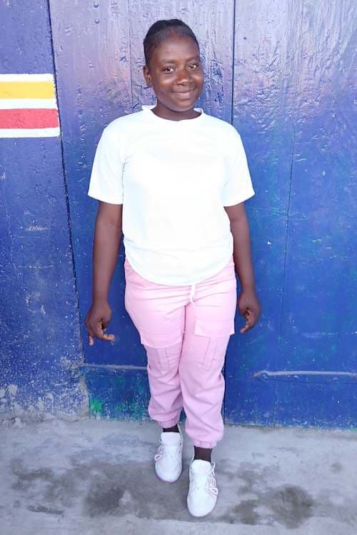 An unsponsored girl named Vaika from Haiti who is vulnerable to exploitation and has waited 940 days for a sponsor.