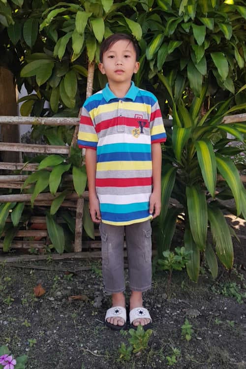 An unsponsored boy named El from Indonesia who has waited 530 days for a sponsor.