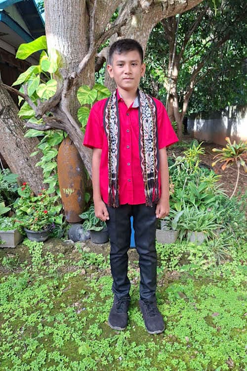 An unsponsored boy named Micky from Indonesia who has waited 385 days for a sponsor.
