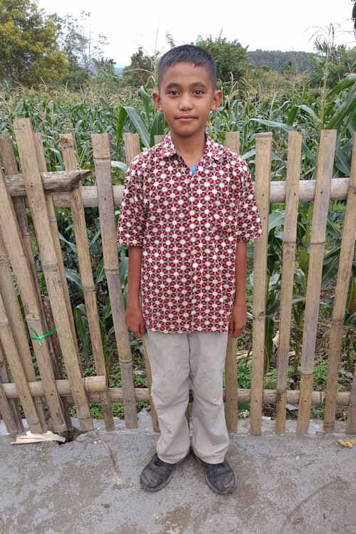 An unsponsored boy named Jogi from Indonesia who has waited 528 days for a sponsor.