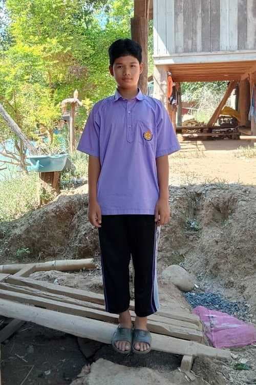 An unsponsored boy named Techatham from Thailand who has waited 565 days for a sponsor.
