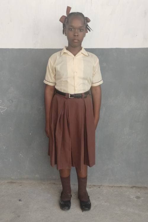 An unsponsored girl named Paola from Haiti who is vulnerable to exploitation and has waited 717 days for a sponsor.
