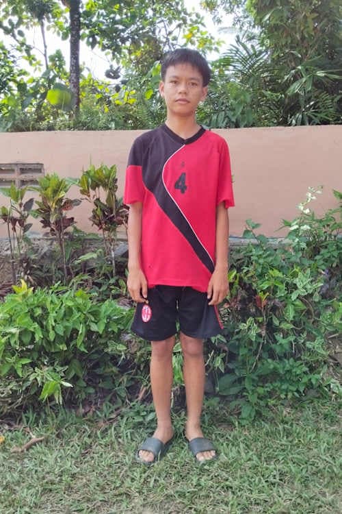 An unsponsored boy named Diki from Indonesia who has waited 502 days for a sponsor.