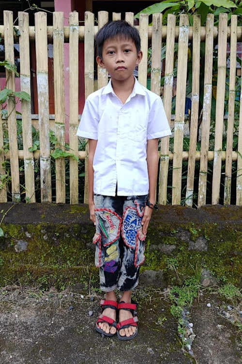 An unsponsored boy named Crist from Indonesia who has waited 549 days for a sponsor.
