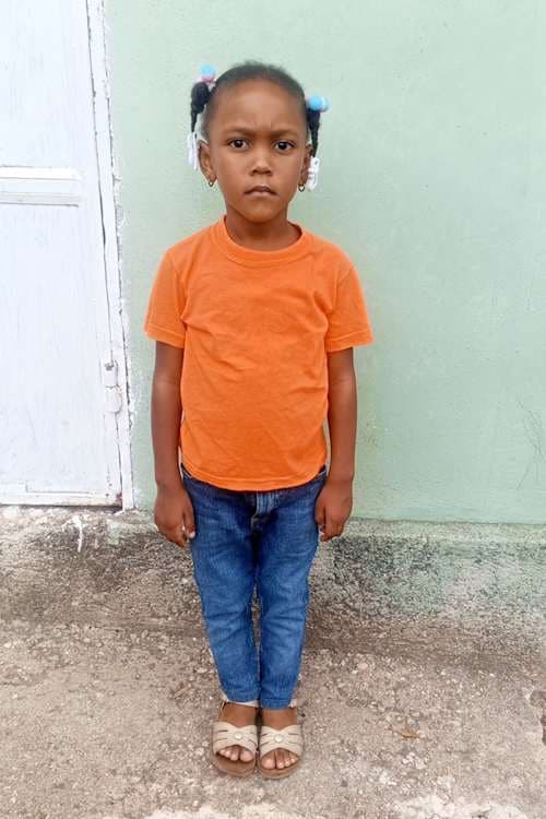 An unsponsored girl named Loralie from Haiti who is vulnerable to exploitation and has waited 441 days for a sponsor.