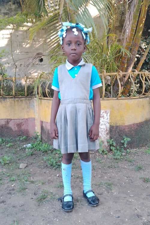 An unsponsored girl named May from Haiti who is vulnerable to exploitation and has waited 452 days for a sponsor.
